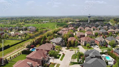 An aerial shot of a residential community and a water tower in Kleinburg Ontario. photo