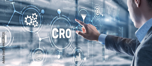 Conversion Rate Optimization. CRO Technology Finance concept Businessman pressing on a virtual screen