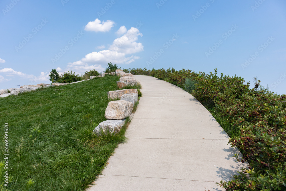 Curving Trail up the Outlook Hill on Governors Island during the Summer in New York City Curving Trail up the Outlook Hill on Governors Island during the Summer in New York City
