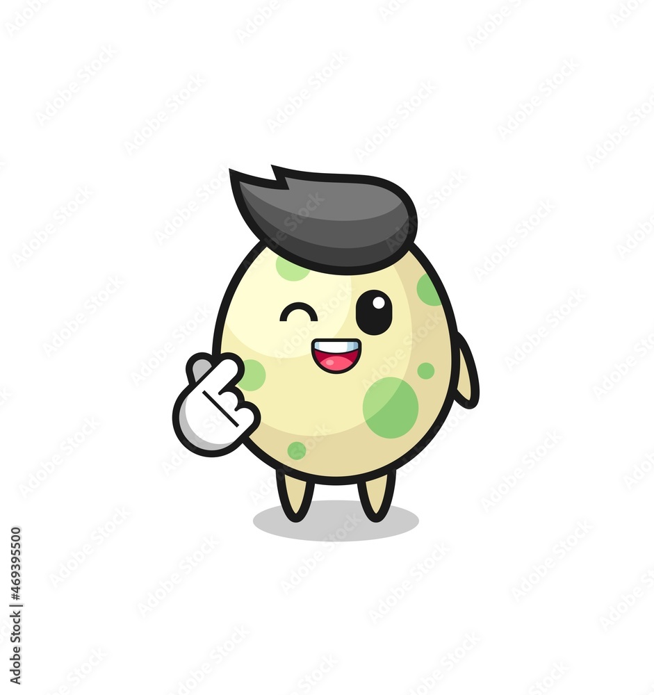 spotted egg character doing Korean finger heart