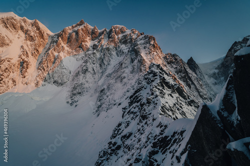 Alpine mountain landscape of Mont Blanc Masiff, Chamonix, France. Alpine peaks, Aiguille du Midi and other famous alpine mountains. Alpinism, climbing, glaciers and snow.