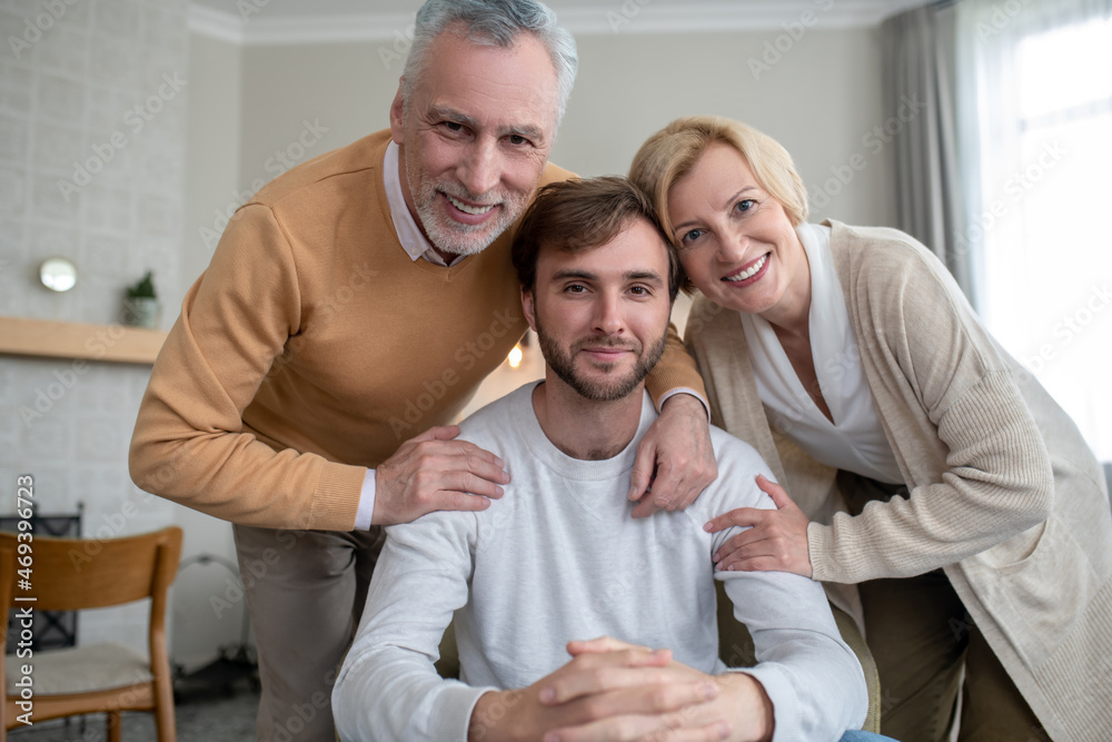 Fototapeta premium Parents happy to see their son, family looking happy