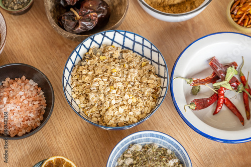 Bowl of breakfast cereals accompanied by other bowls with ingredients to prepare different meals