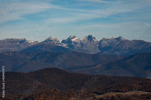Immense landscape of the Aragonese Pyrenees, on a cold autumn day, mountainous landscape speckled by the first fallen snow, Spain