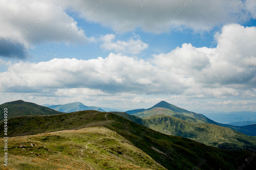 Incredibly beautiful panoramic views of the Carpathian Mountains. Peaks in the Carpathians on a background of blue sky Incredibly beautiful panoramic views of the Carpathian Mountains. Peaks in the Carpathians on a background of blue sky