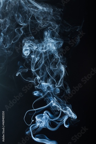 The abstract pattern made from smoke rising from an incense stick.