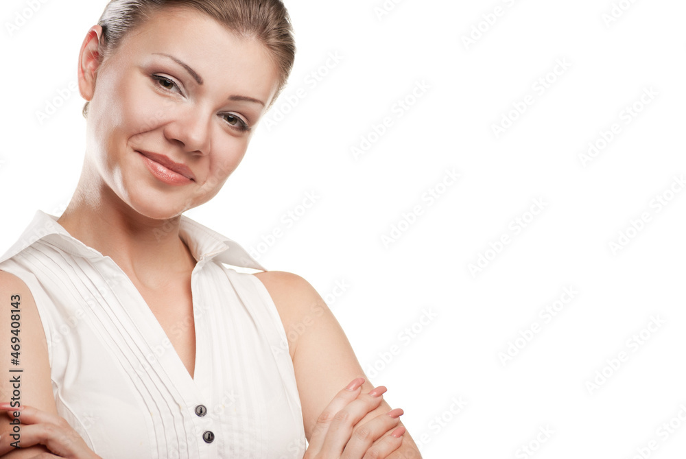 Portrait of a happy young business woman standing with folded hand against white background Portrait of a happy young business woman standing with folded hand against white background