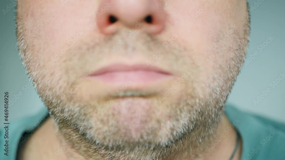 A sick man badly coughing. Close-up of a hospital patient face. Asthma bronchitis patient suffocates. Mature unshaved sickness man with a gray beard. Need medical help and an appointment with a doctor A sick man badly coughing. Close-up of a hospital patient face. Asthma bronchitis patient suffocates. Mature unshaved sickness man with a gray beard. Need medical help and an appointment with a doctor