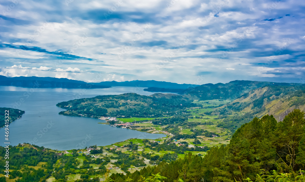The beauty of Lake Toba which is a caldera lake comes from an ancient volcanic eruption and is the largest volcanic lake in the world. View from geosite hutaginjang. North Sumatra, Indonesia