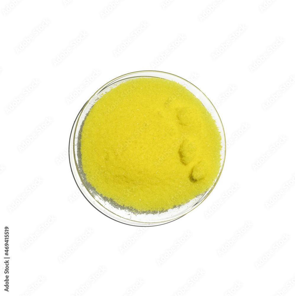 Close up chemical ingredient on white laboratory table. Potassium Chromate powder in Chemical Watch Glass. Top View Close up chemical ingredient on white laboratory table. Potassium Chromate powder in Chemical Watch Glass. Top View