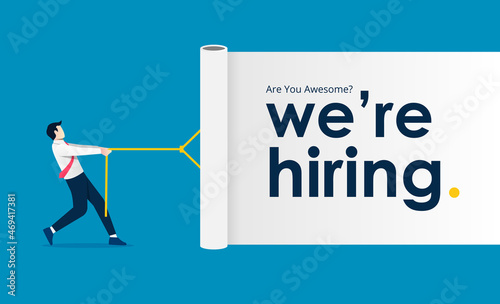 Businessman pulling white curtain with the text we are hiring. Business recruiting design concept.