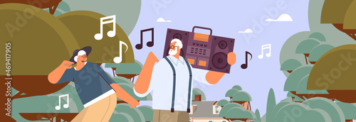 senior family with bass clipping blaster recorder dancing and singing grandparents having fun active old age concept