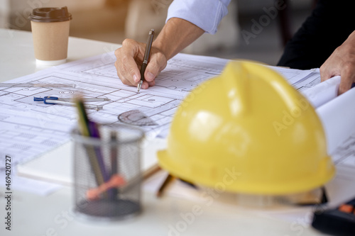 Engineer work environment, Engineers are reading blueprints and calculating professionally.