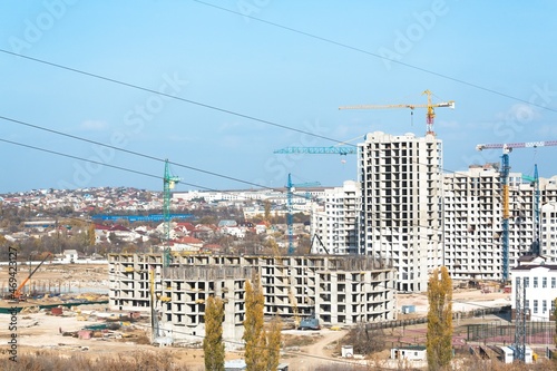 The architectural complex of residential buildings on sky background