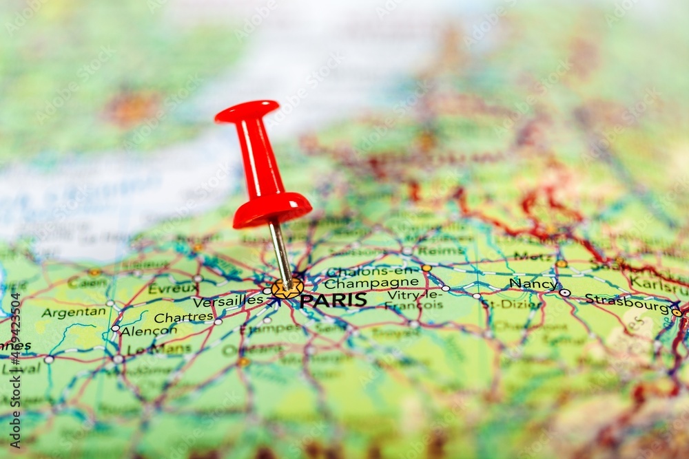 push pin pointing at Paris, France push pin pointing at Paris, France