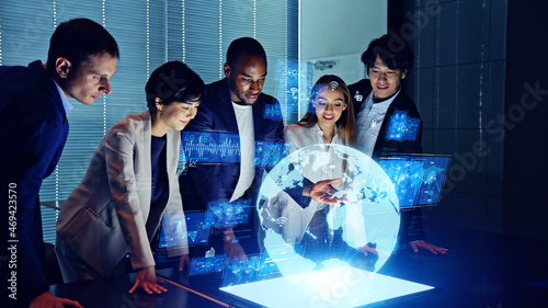 Group of multi racial people watching hologram display. Global business. Management strategy. Science technology. Sustainable development goals. SDGs. photo