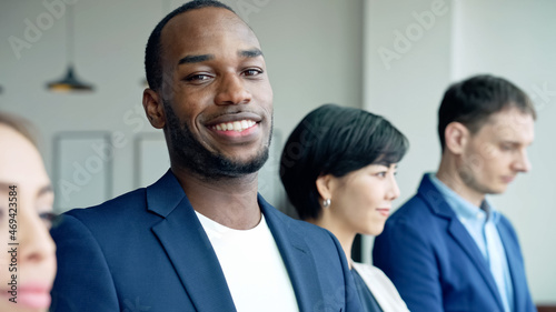 African businessman smiling in the office. Global business.