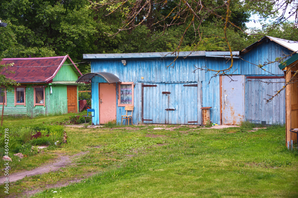 Fototapeta premium Small old wooden huts in the village