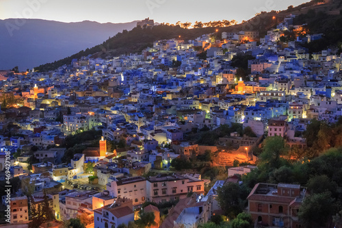 Aerial evening view of Chefchaouen in Morocco. The city is noted for its buildings in shades of blue and that makes Chefchaouen very attractive to visitors. © Renar