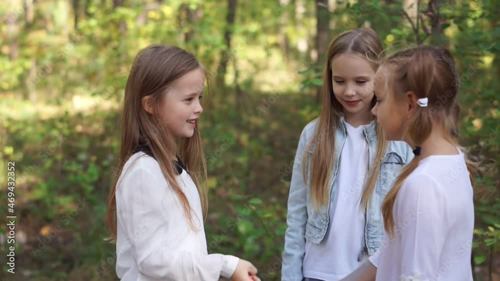 Young active girls decide on a rock paper scissors who will enter the game of hide and seek. Young active girls decide on a rock paper scissors who will enter the game of hide and seek.