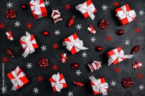 Christmas composition of gifts and decoration on black background.