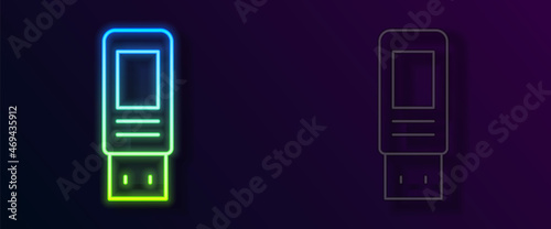 Glowing neon line USB flash drive icon isolated on black background. Vector