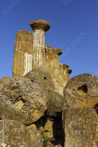 Ancient greek temple ruins detail in Valle dei Templi archelogical park, Agrigento, Sicily, Italy photo