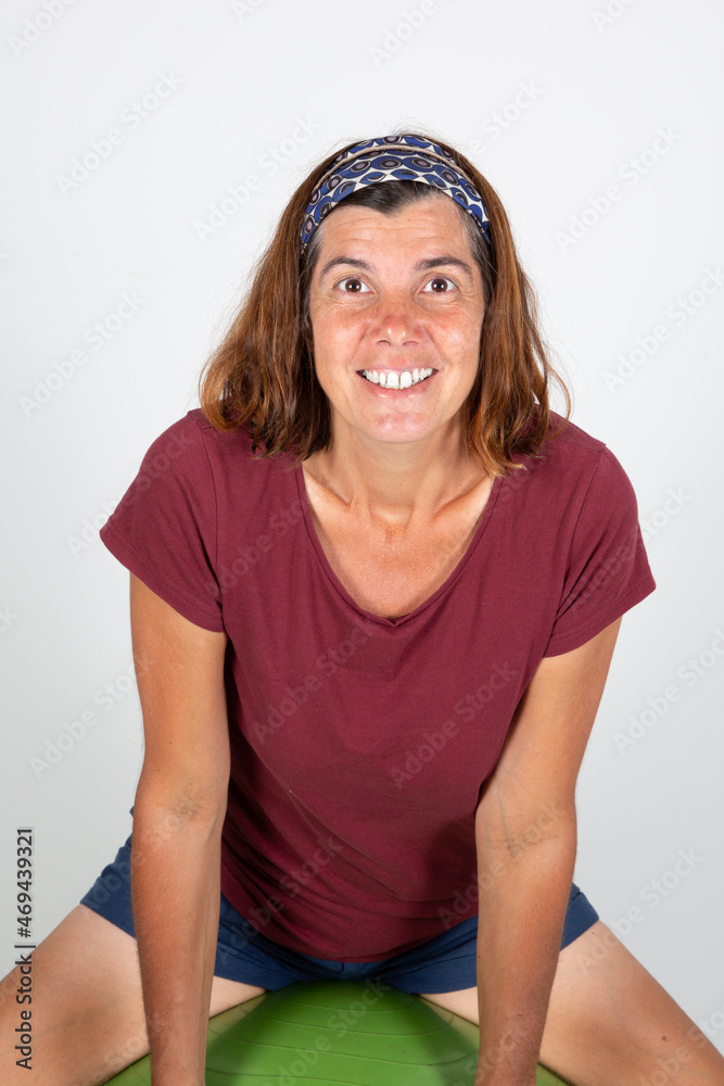 sporty smiling portrait of attractive middle-aged woman isolated on white background sporty smiling portrait of attractive middle-aged woman isolated on white background
