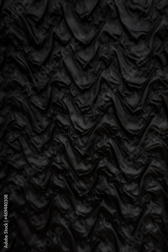 Background of black wavy silk fabric