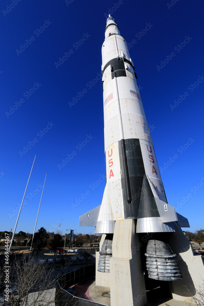 The world's only vertical fullscale model of a Saturn V in front of the Saturn V Hall at the