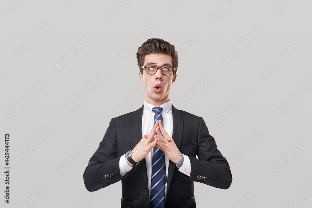 Funny businessman meditating with rolled eyes Funny businessman meditating with rolled eyes
