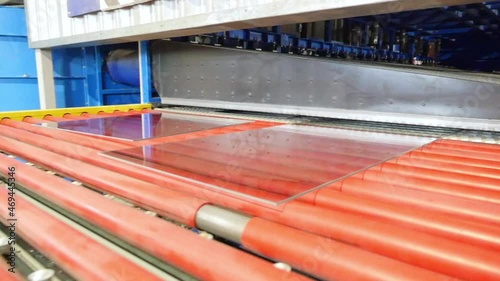 Tempered glass coming out of the glass tempering machine.
