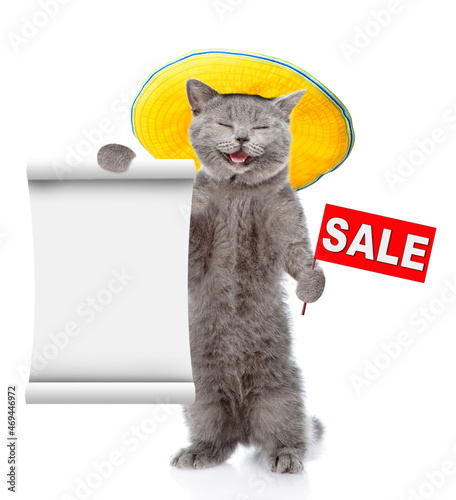Happy cat wearing tiny summer hat holds sales symbol and shows empty list. isolated on white background