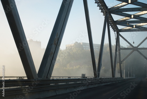 Automobile bridge in the morning fog