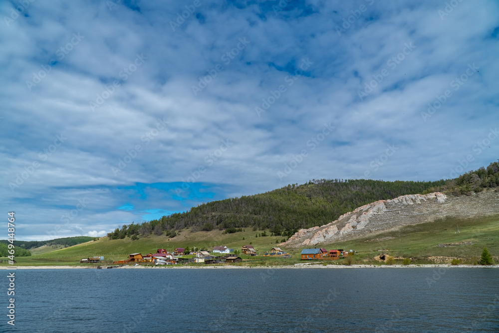 View from the sea to the Uzury village. Olkhon coast of Lake Baikal
