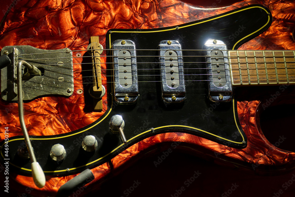 old electric guitar. wooden electric guitar. red electric guitar Stock Photo Adobe Stock