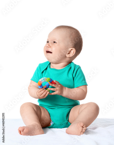 Upset little baby boy playi...