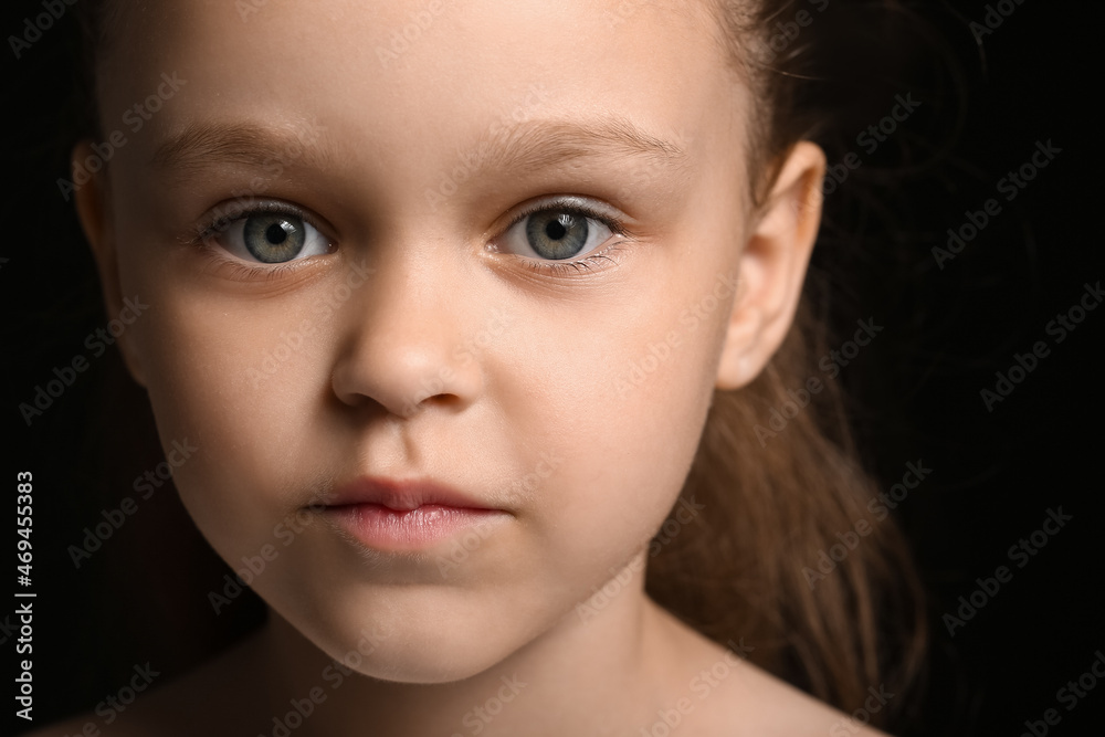 Portrait of pretty little girl on black background, closeup Portrait of pretty little girl on black background, closeup
