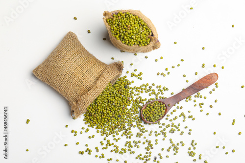 Quadro em tela Green gram or mung bean in bag over white background.