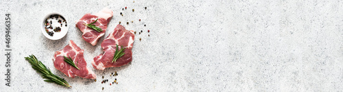Fresh meat. Food delivery. Beef with salt and rosemary on a concrete background, top view.