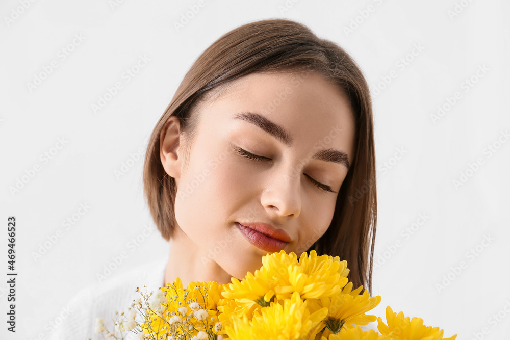 Pretty young woman with bouquet of flowers on white background Pretty young woman with bouquet of flowers on white background