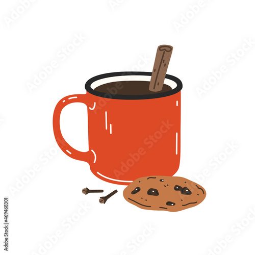 Warming drink with cinnamon stick and chocolate chip cookie in a red enamel mug