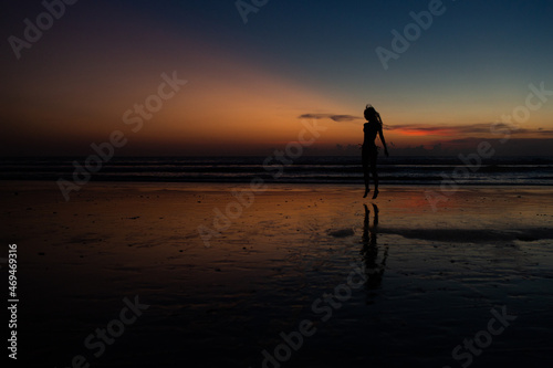 beautiful girl dancing at sunset. © alexzhilkin
