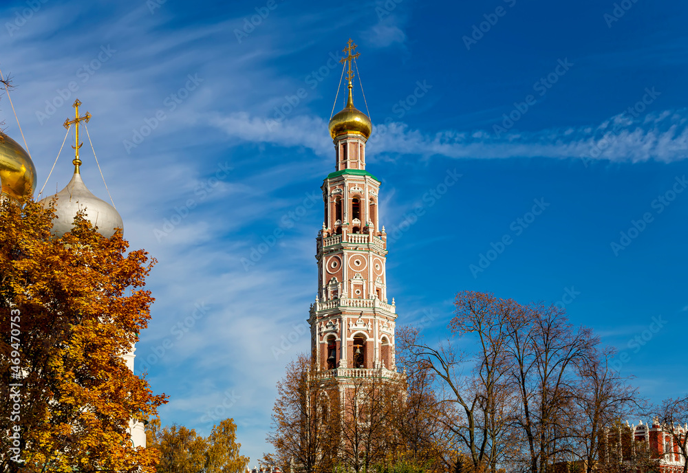 Novodevichy convent (Bogoroditse-Smolensky monastery) on a sunny autumn day. Octagonal bell-tower (1689–90).  Moscow, Russia. UNESCO world heritage site