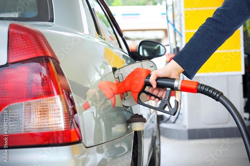 Filling the car with gasoline at gas stations.