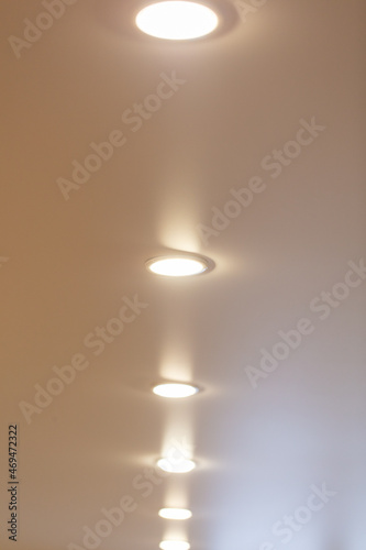 White light bulbs on a stretch ceiling