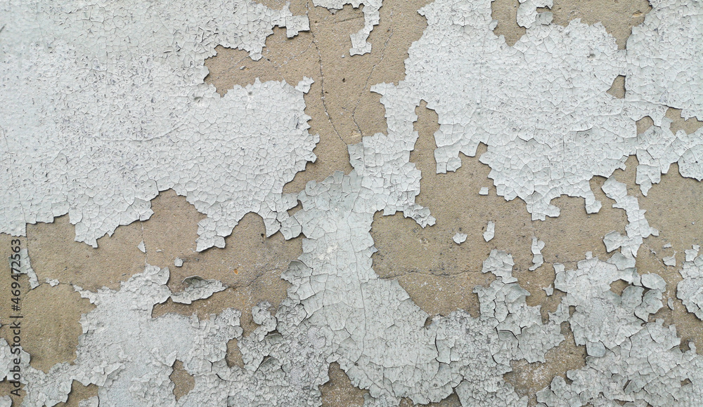 Fototapeta premium White cracked paint on the wall