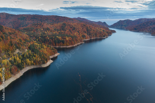 Aerial view of colorful mountain road, at Vidraru Dam - Transfagarasan Highway, Romania, during autumn