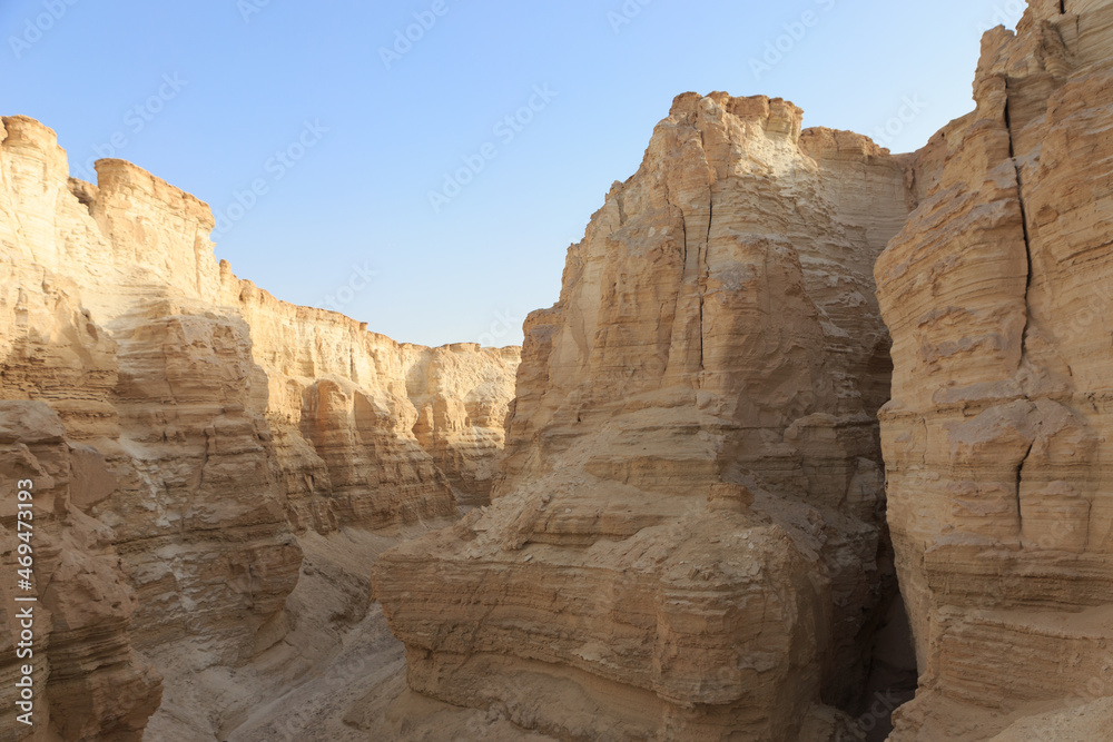 high rocky canyon walls in the judean desert
