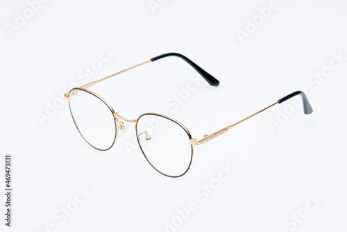 Fashion sunglasses two tone black and gold frame on white background.